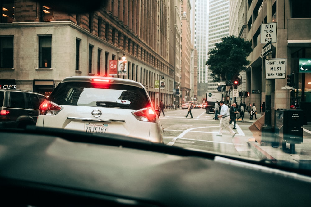 white SUV on road