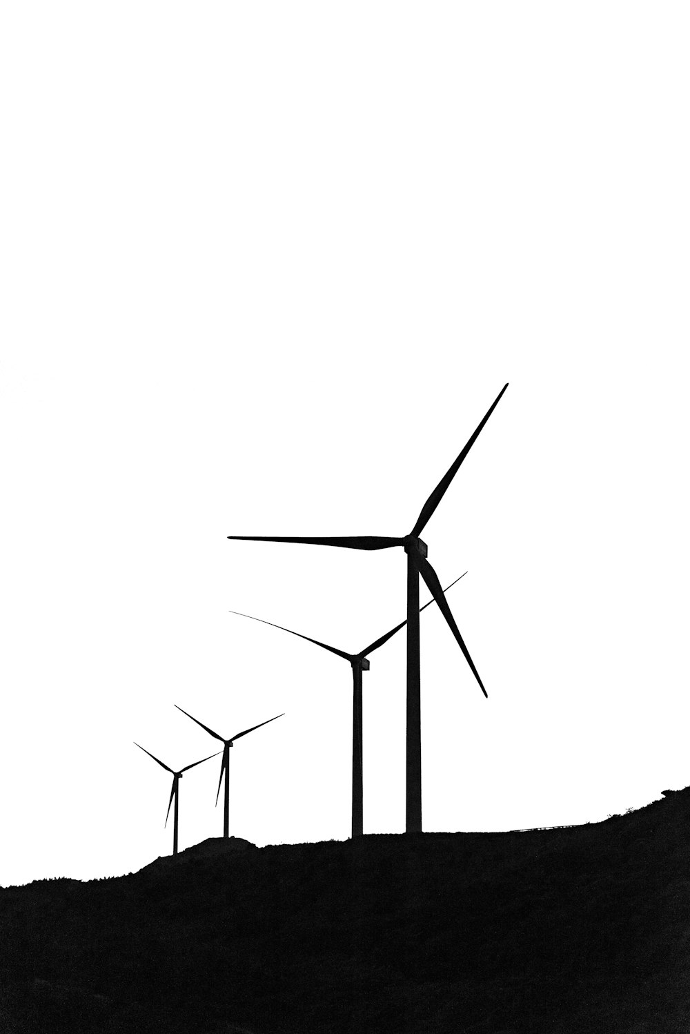 silhouette of turbines during daytime