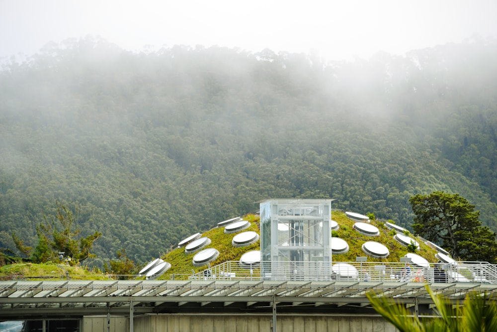 clear glass building near mountain