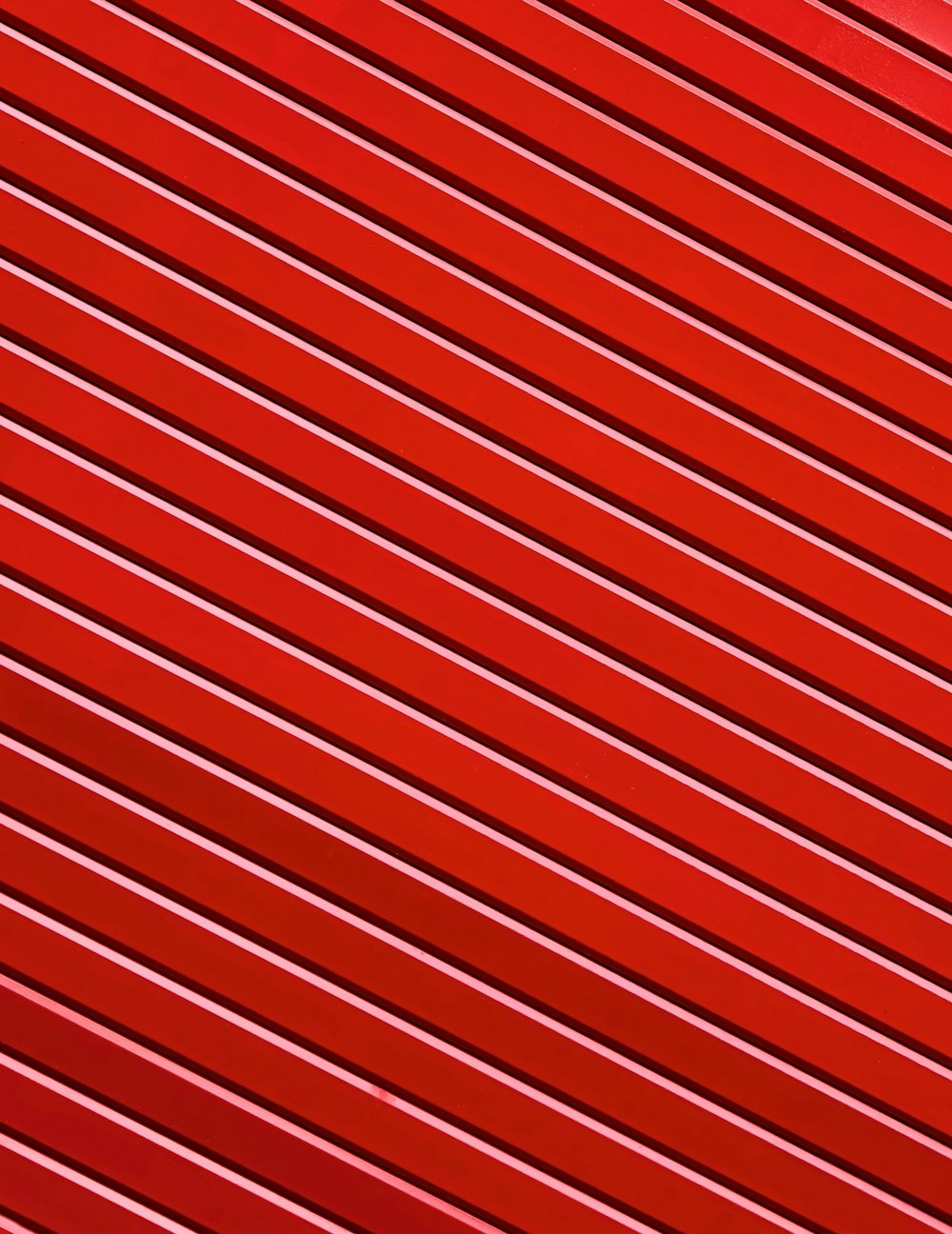 a close up of a red metal surface