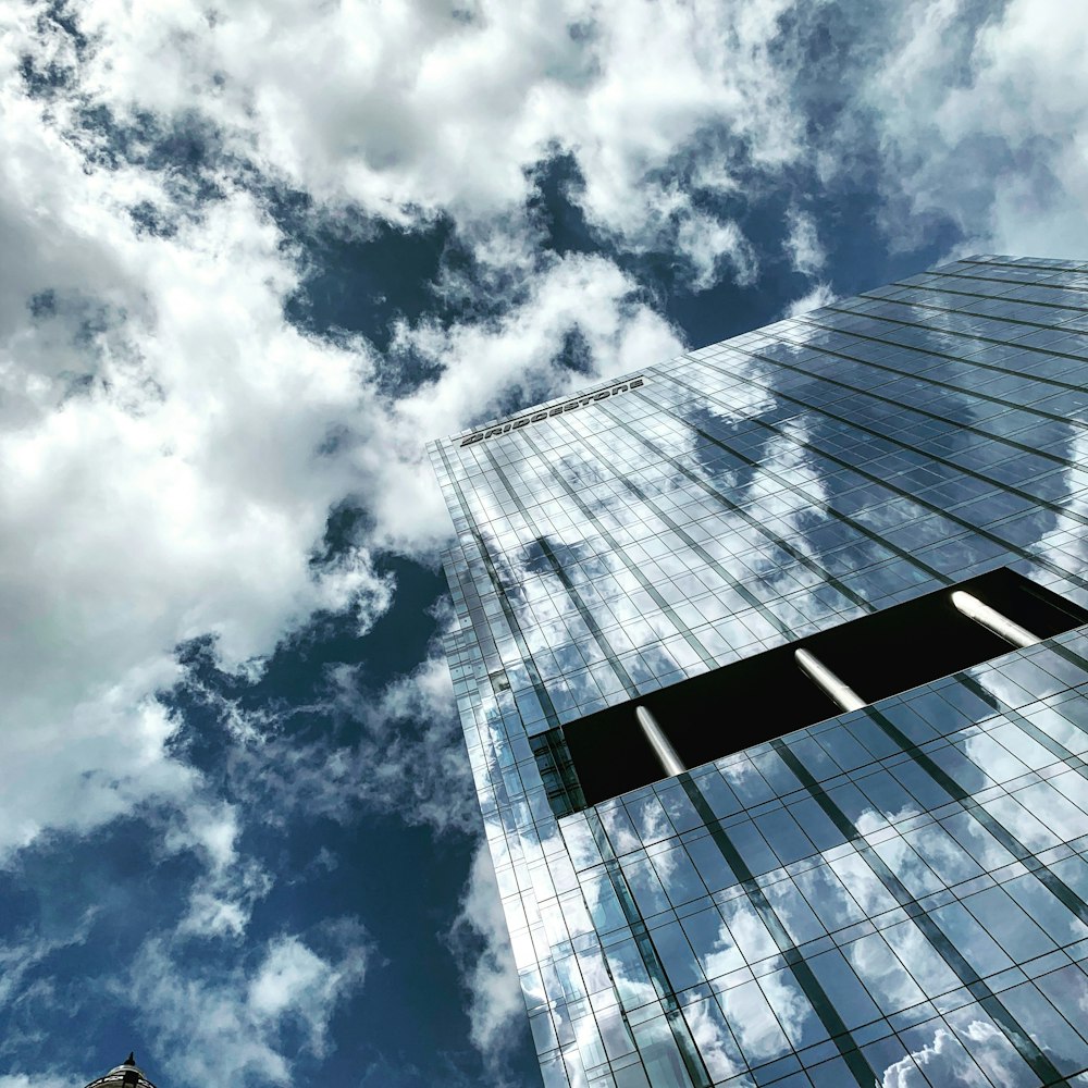 low angle photography of clouds and building