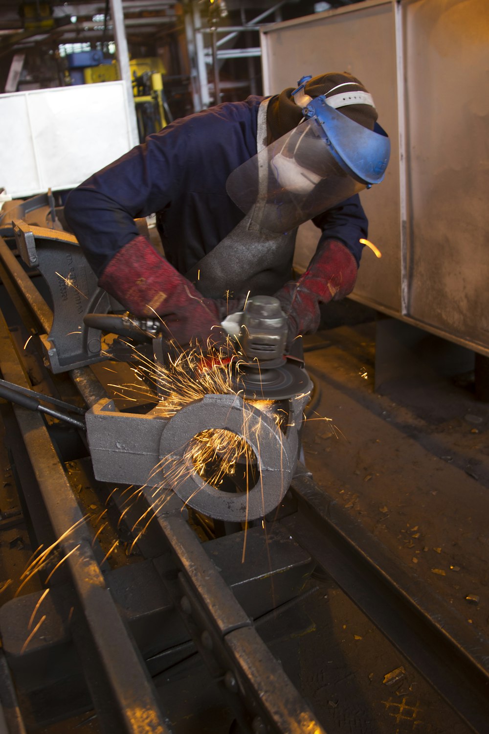 man standing and welding