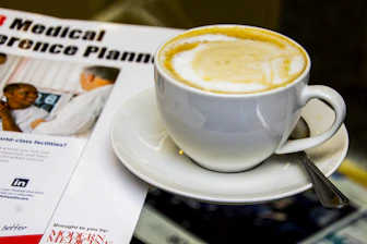 cappuccino near gray stainless steel teaspoon