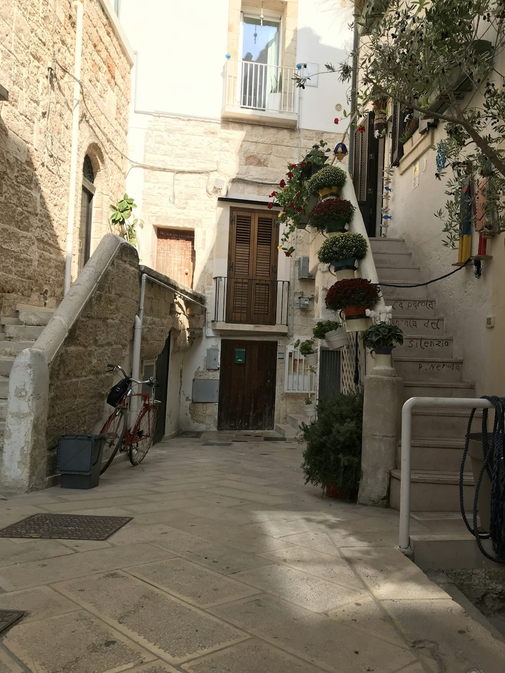 parked bike beside stair wall