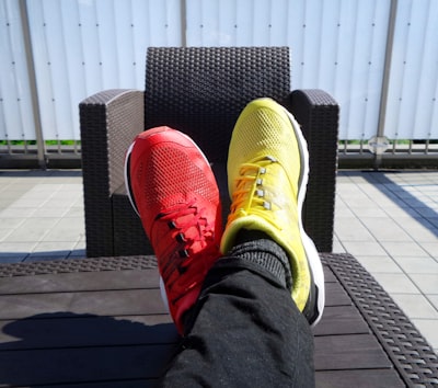 pair of red-and-yellow sneakers different zoom background