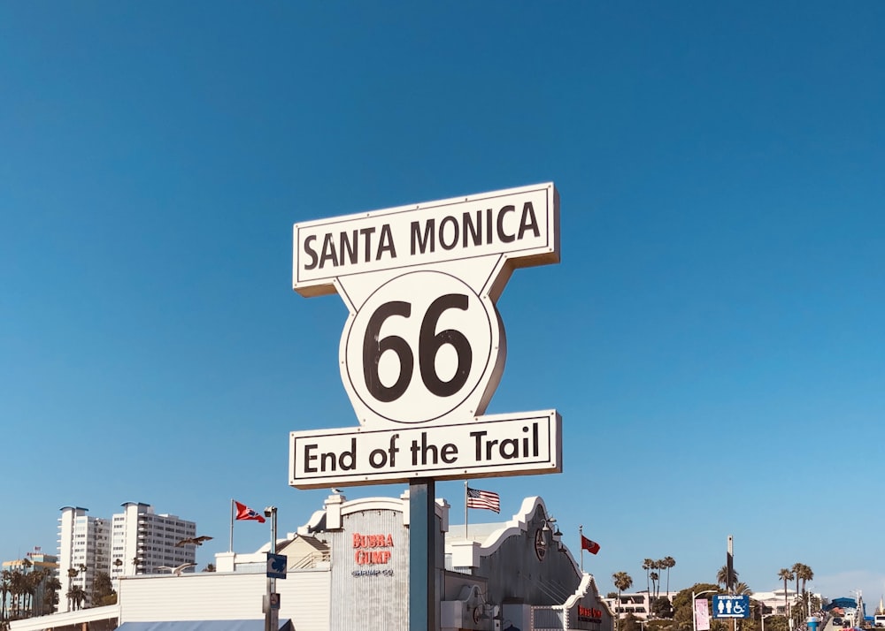 a street sign for santa monica and the end of the trail