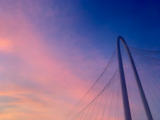 Sunset view of a completed bridge with strong, clean lines highlighting craftsmanship.