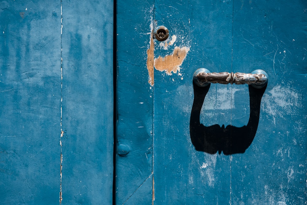 a blue door with a handle on it