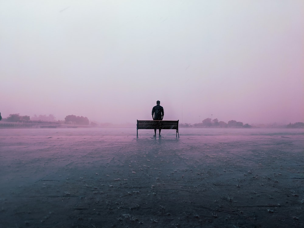 man sitting on bench