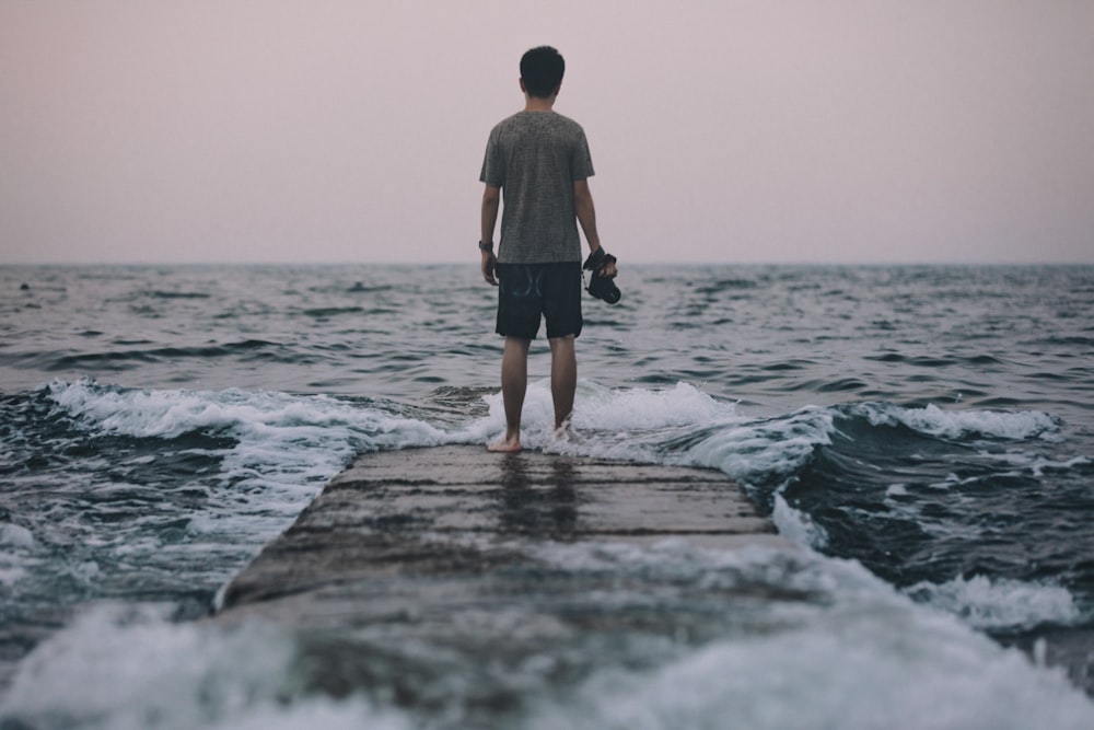 man standing on dock