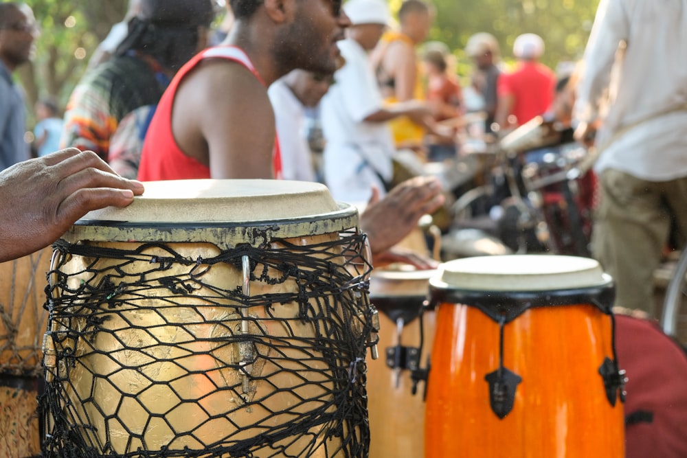 a group of people playing musical instruments in a park