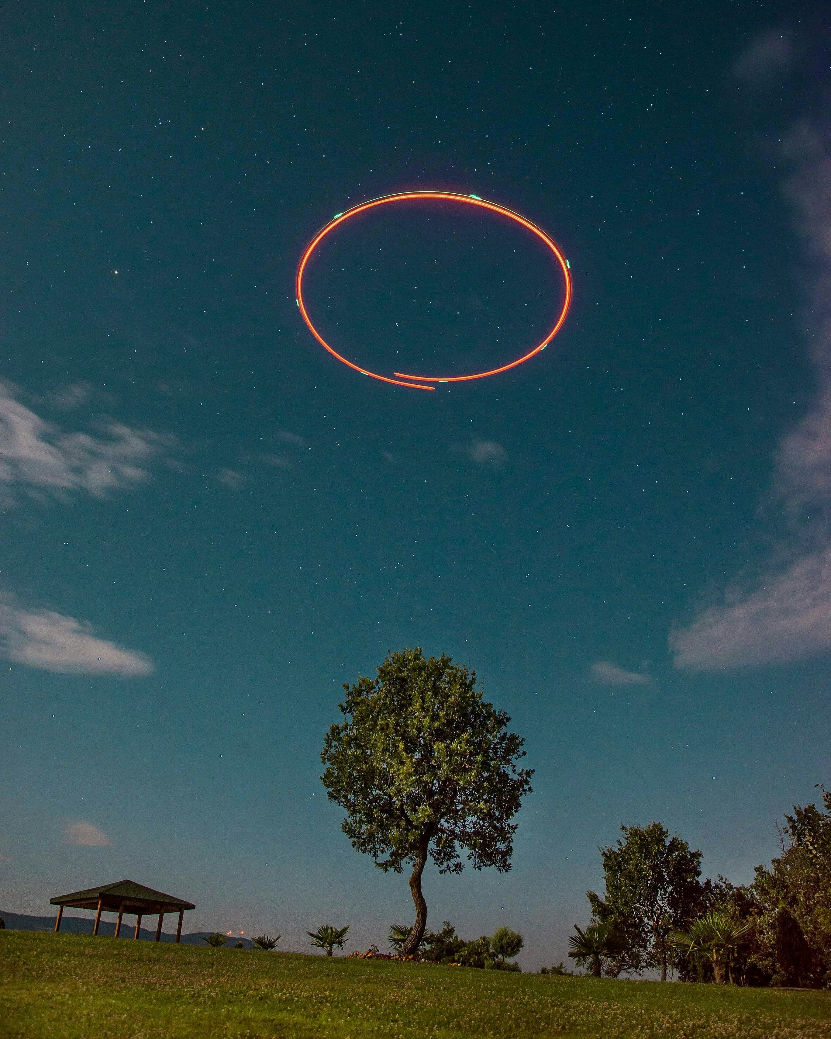 red ring on sky during daytime