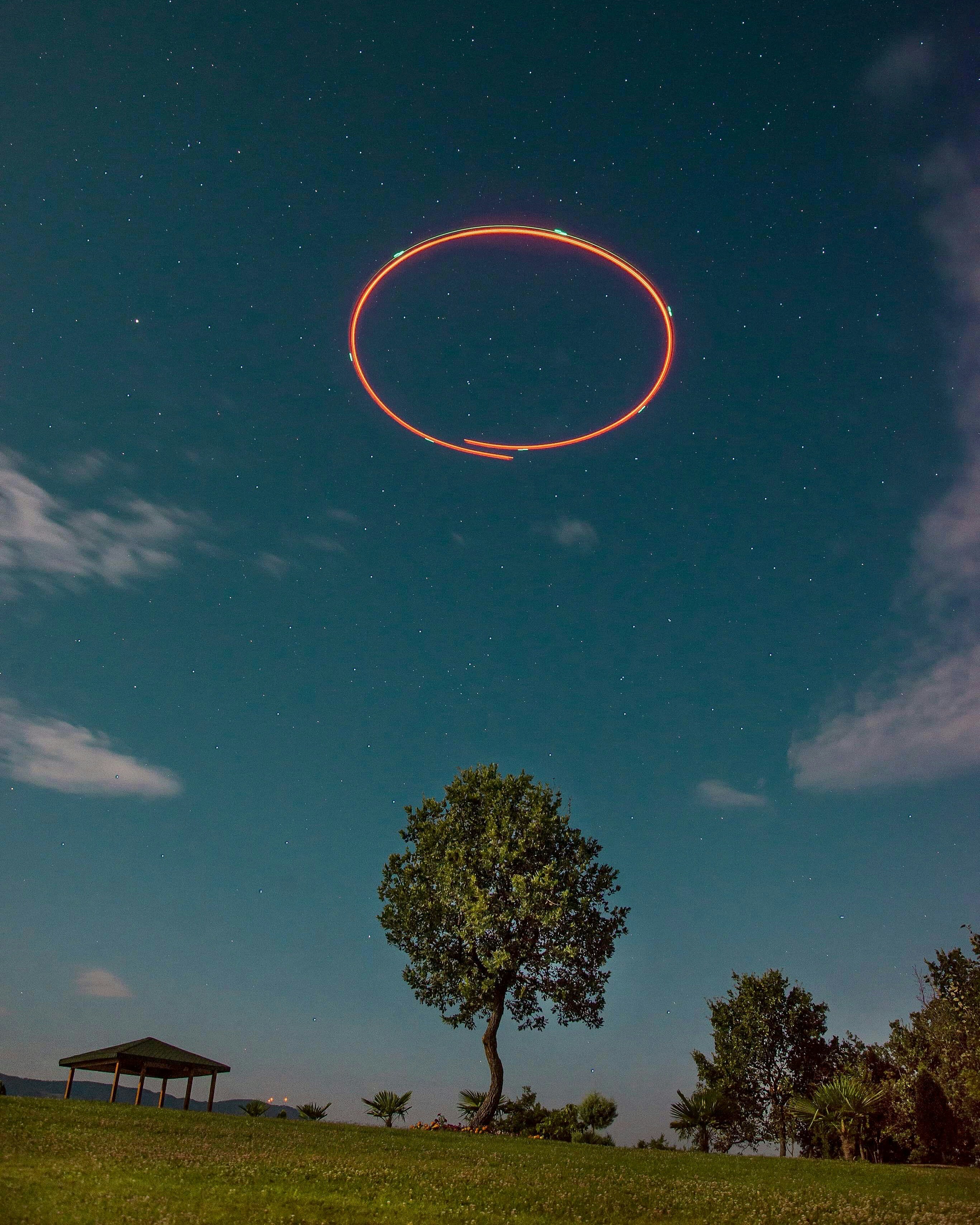 &quot;Long exposure of a drone circling on top of a tree in my backyard &quot;