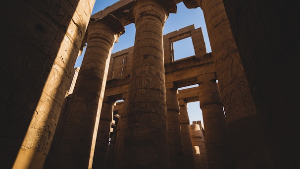 the columns of a building with writing on them