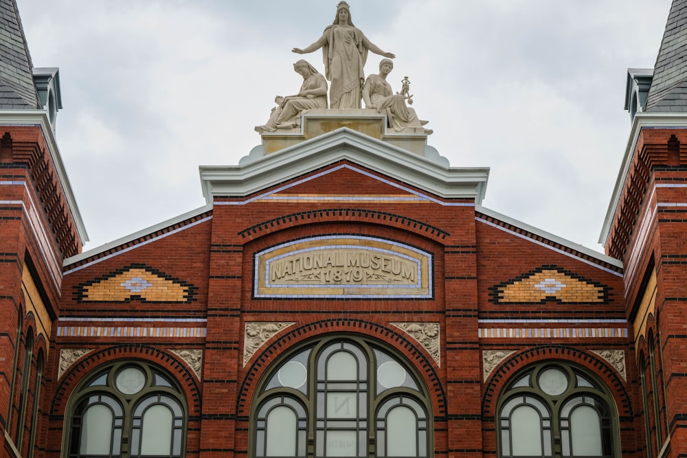 a building with a statue on top of it