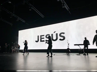 a group of people standing on top of a stage