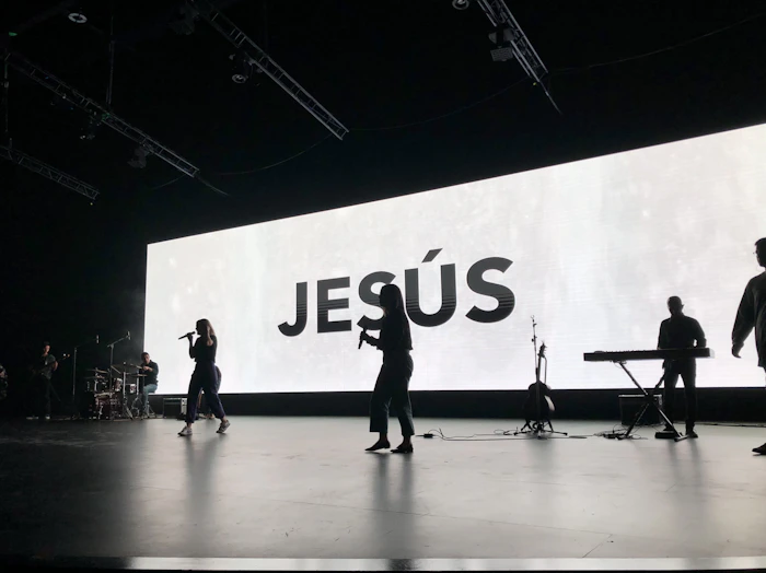 a group of people standing on top of a stage