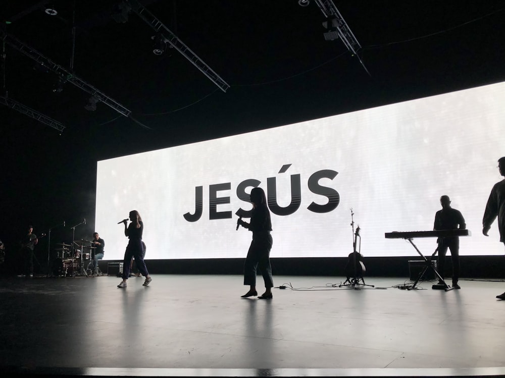 a group of people standing on top of a stage