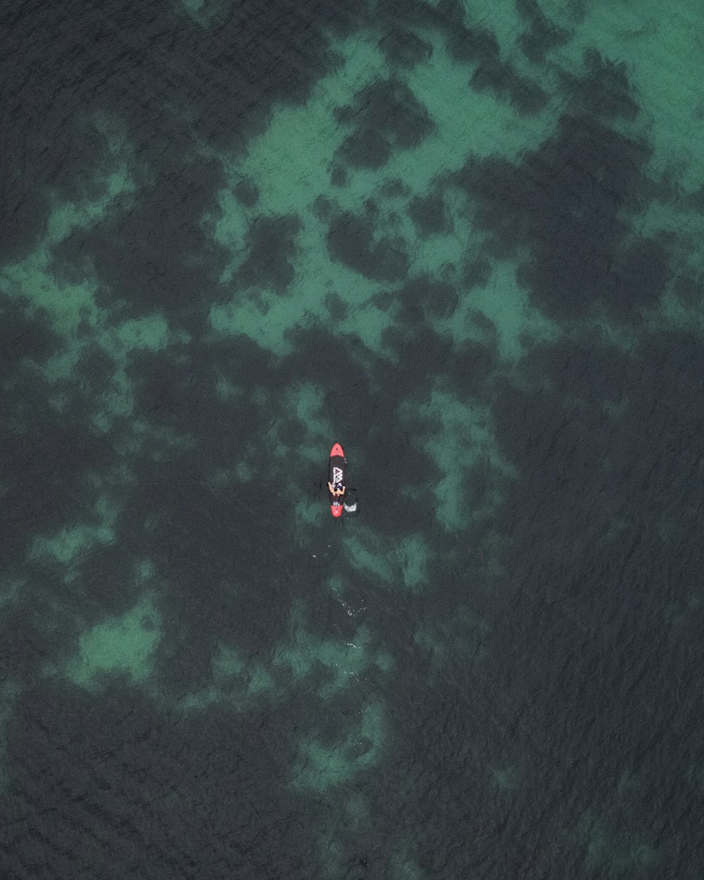 bird's-eye photography of person on boat