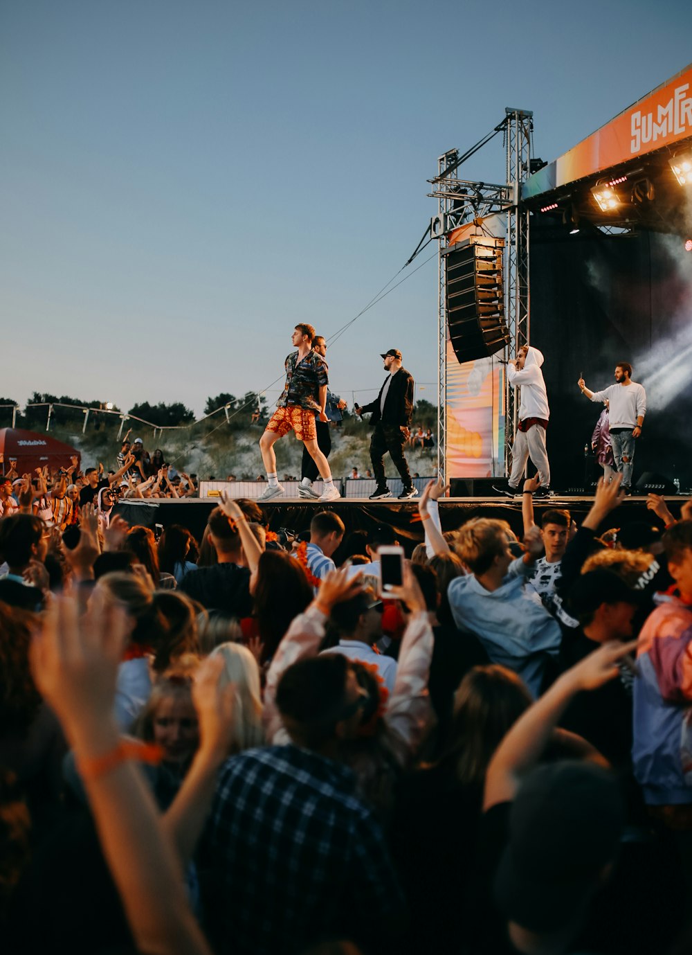 group of male performing on stage