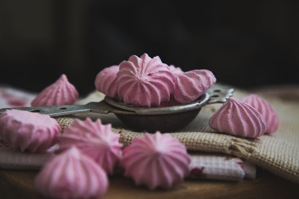 pink meringues on white textile
