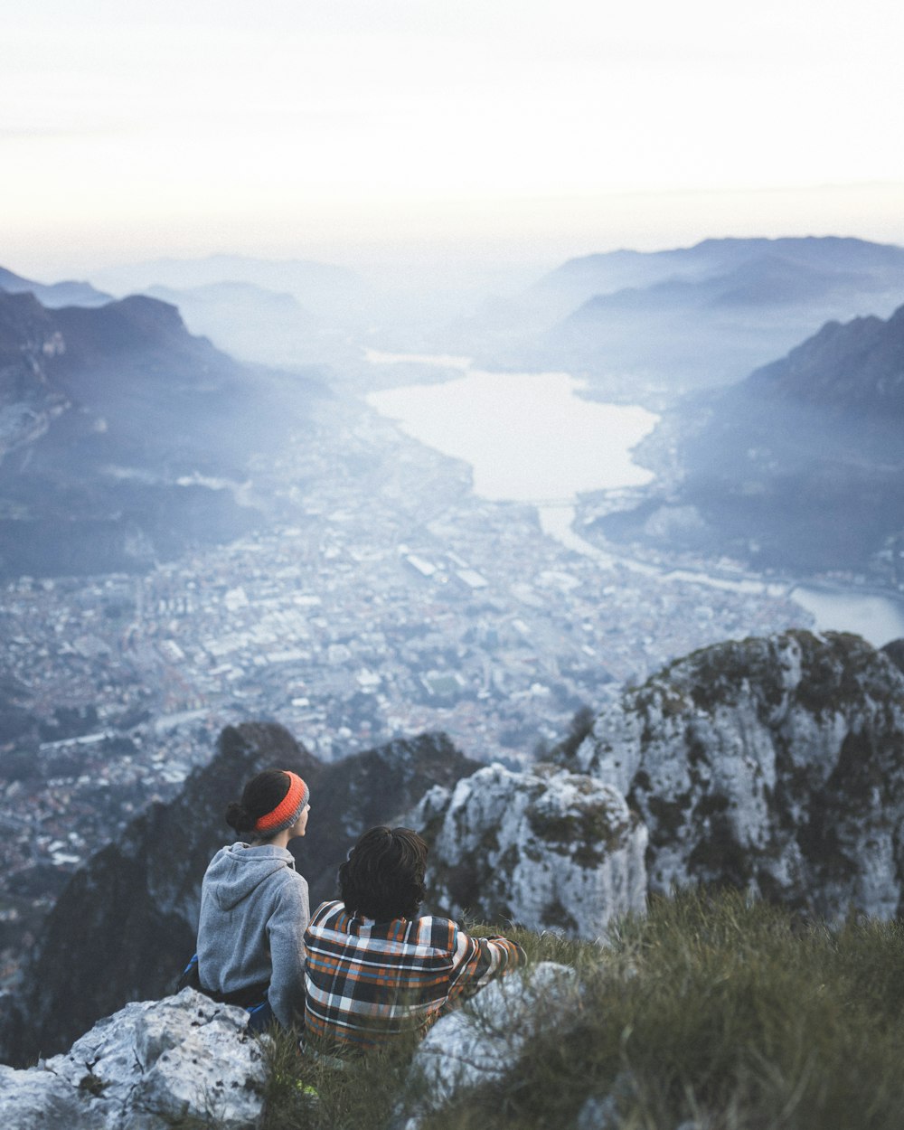 couple at the top of mountain looking down