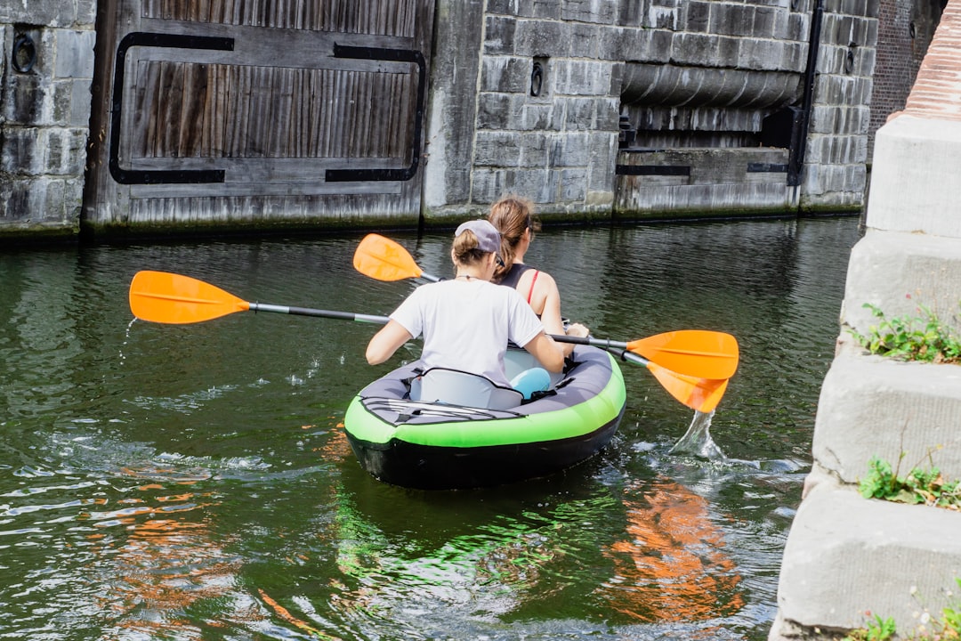 two persons riding on boat,