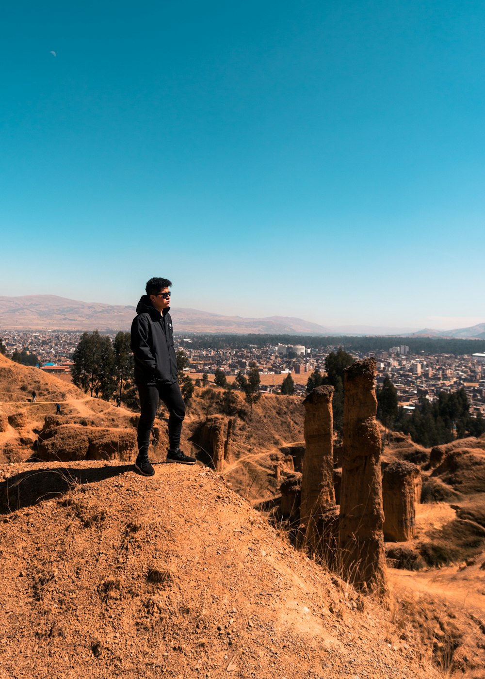 man standing mount under blue sky