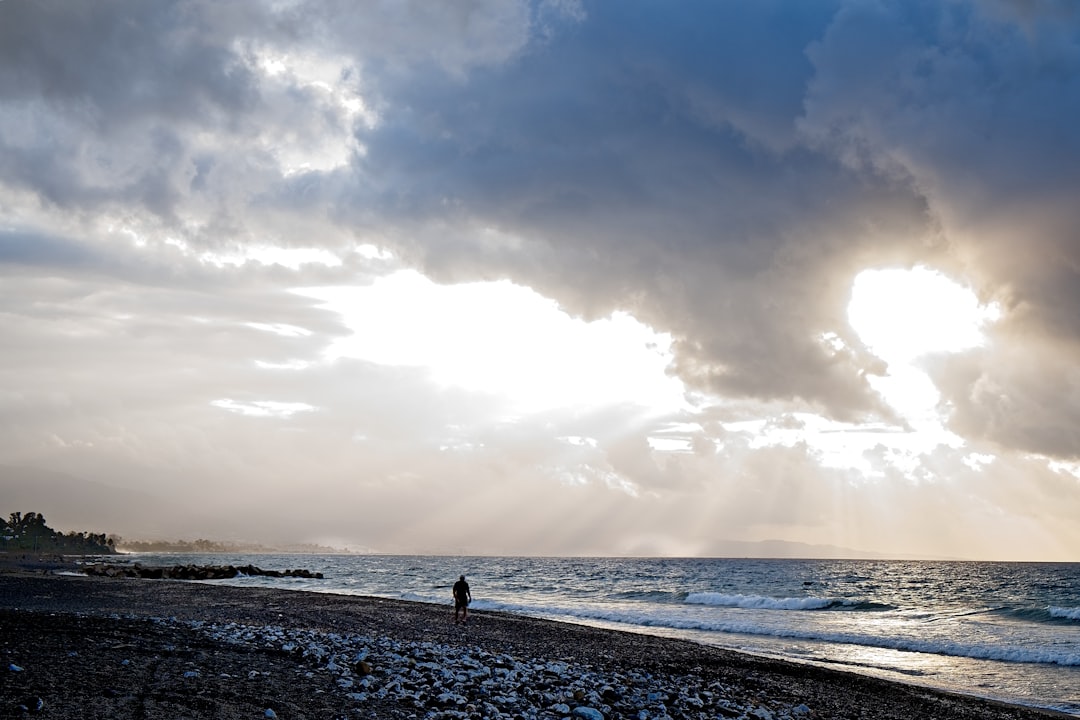 person standing in seashore