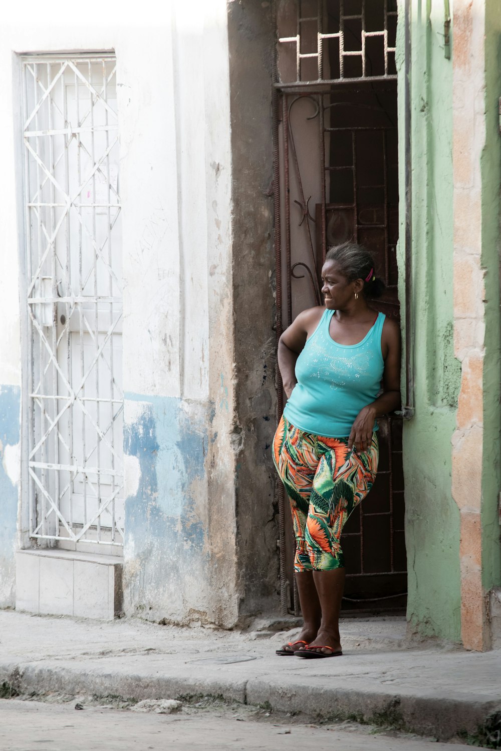 woman standing beside door