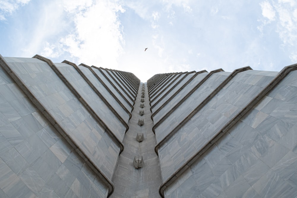 a very tall building with a sky background