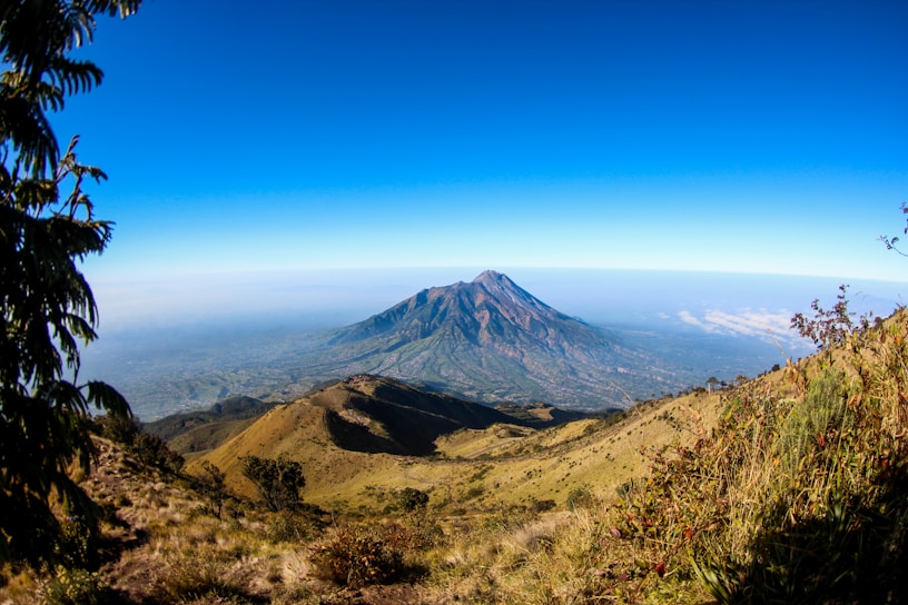 A panoramic view of the majestic Karakoram mountain range under a clear blue sky.