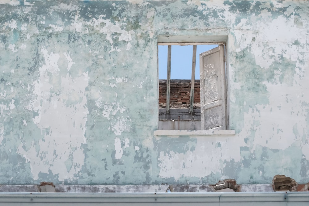 white window on concrete wall