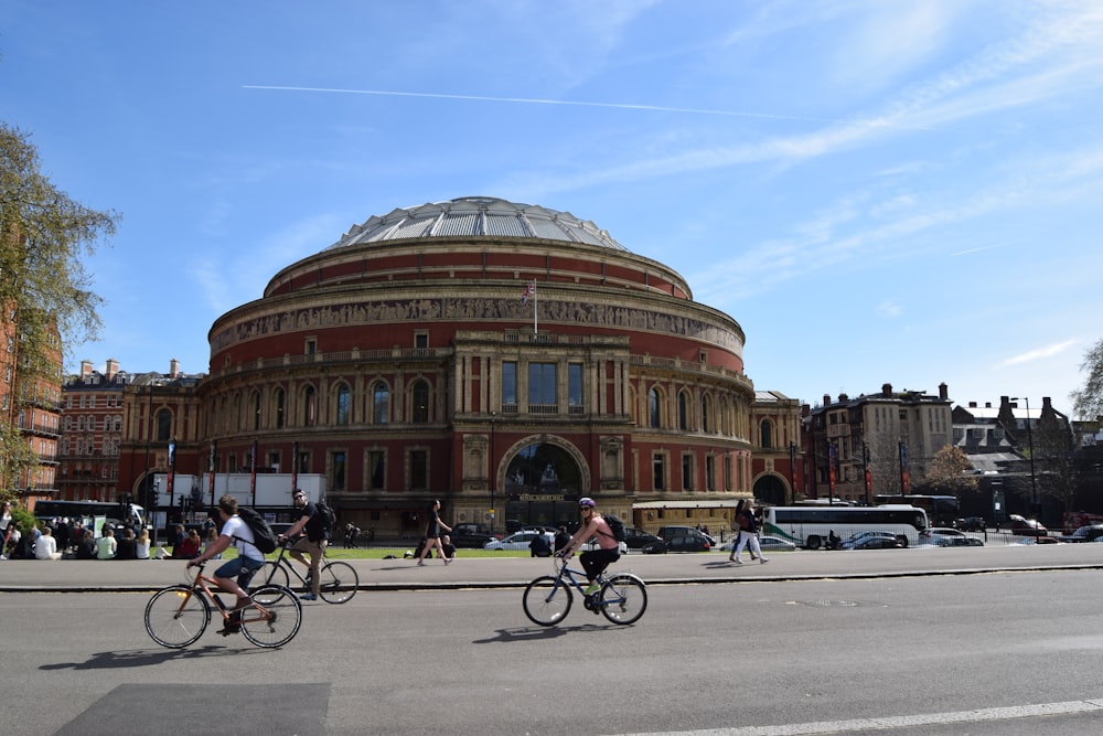 people riding bikes on road