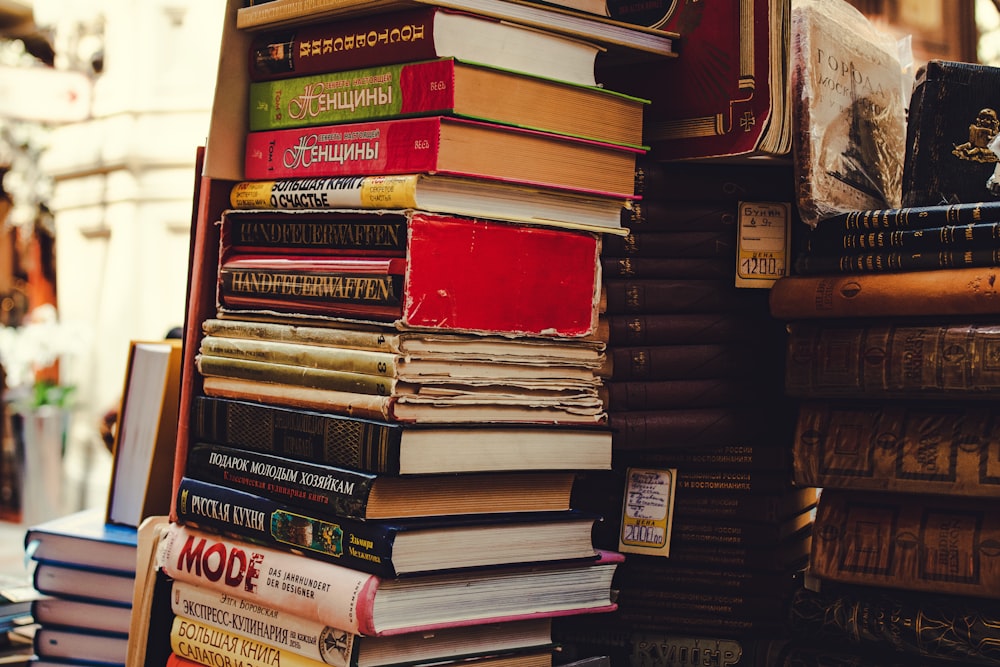 pile of assorted-title hardbound books