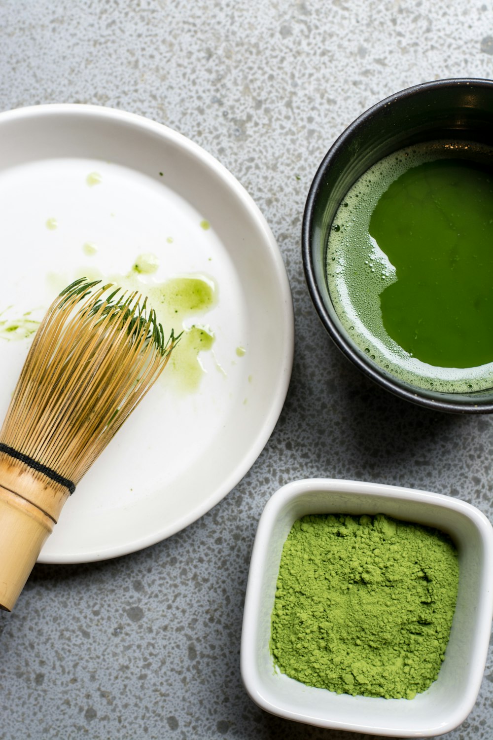 green powder in white bowl