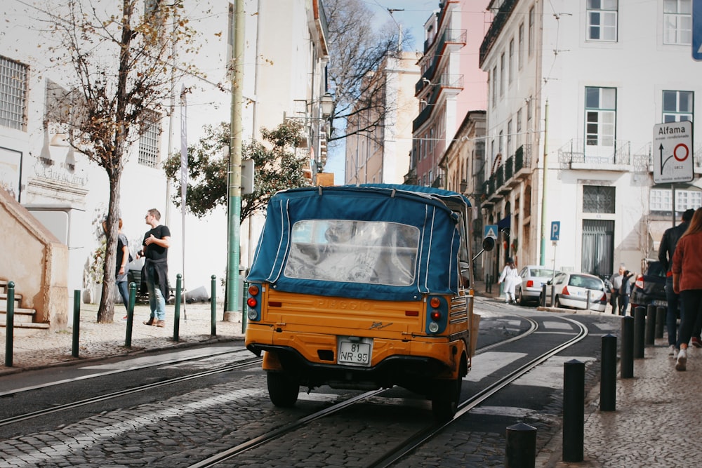 vehicles on road and people on sidewalk