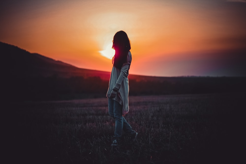 woman wearing white dress and blue jeans