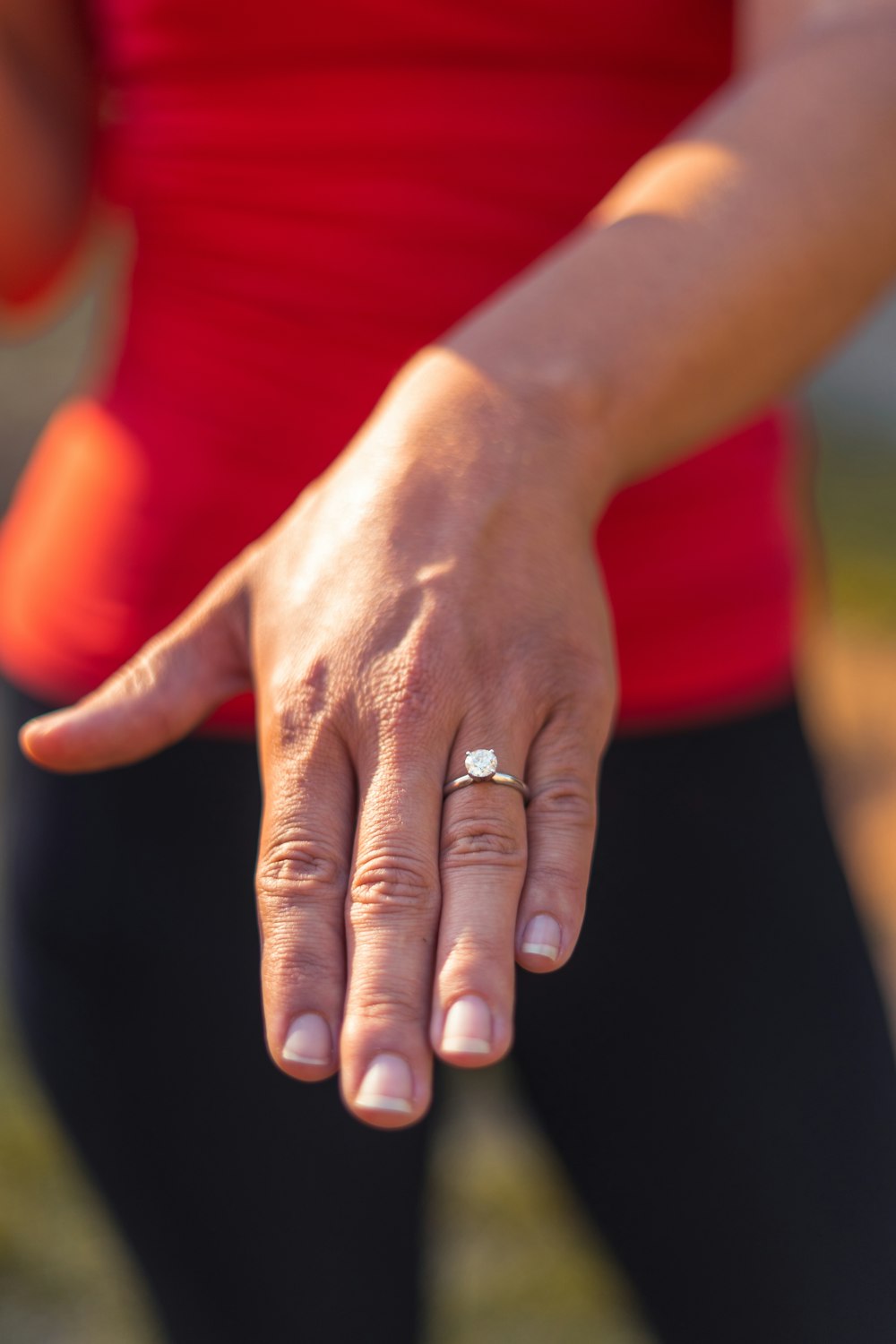 silver-colored solitaire ring