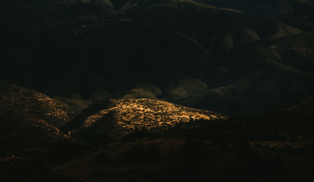 a view of a mountain range at night