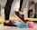 person standing beside yoga mat