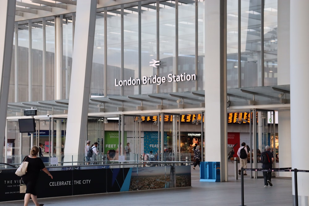 people in front and in London Bridge Station during day