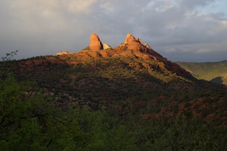 A serene view of Zion’s red rock cliffs bathed in warm sunlight, inviting peace and reflection.