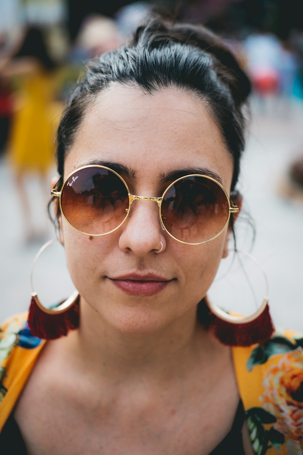 woman in gold-framed Ray-Ban hippie sunglasses