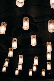 Modern LED lighting fixtures installed in a commercial workshop, glowing warmly.