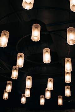 Modern LED lighting fixtures installed in a commercial workshop, glowing warmly.