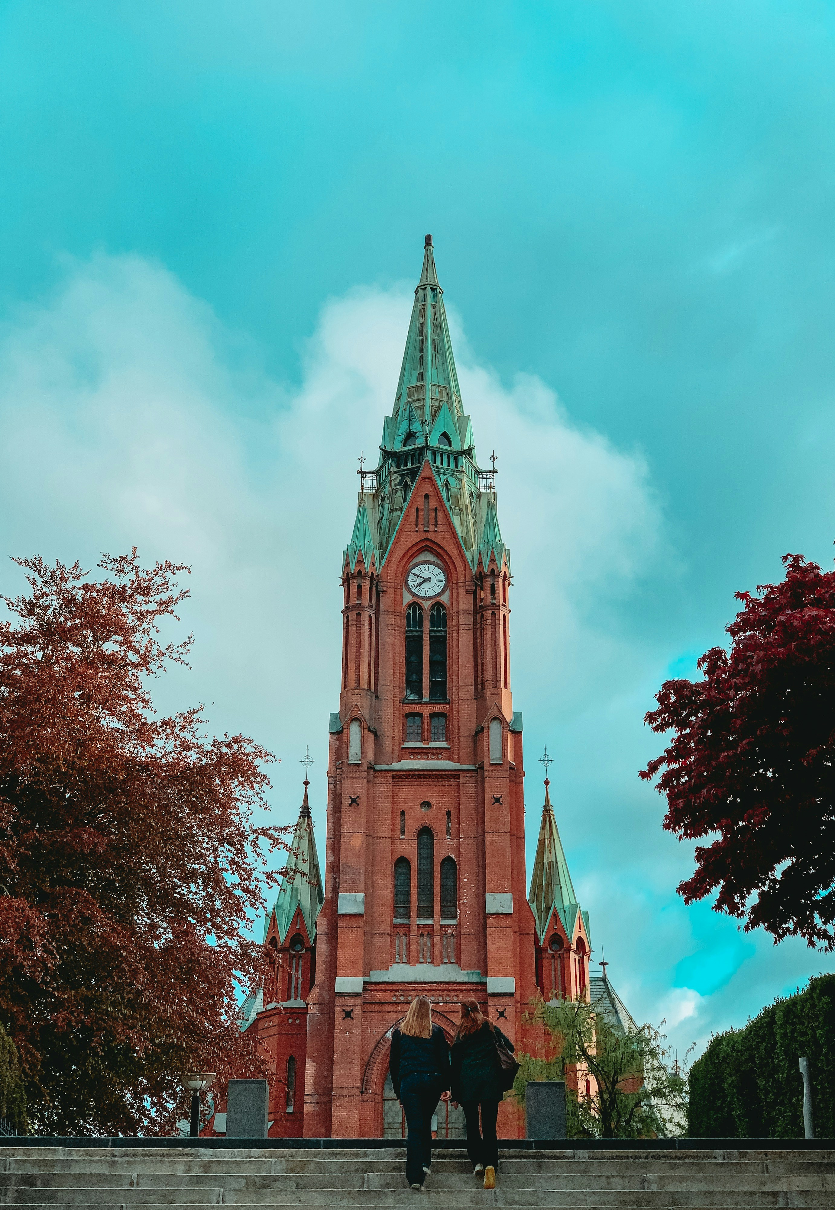 two person's facing cathedral