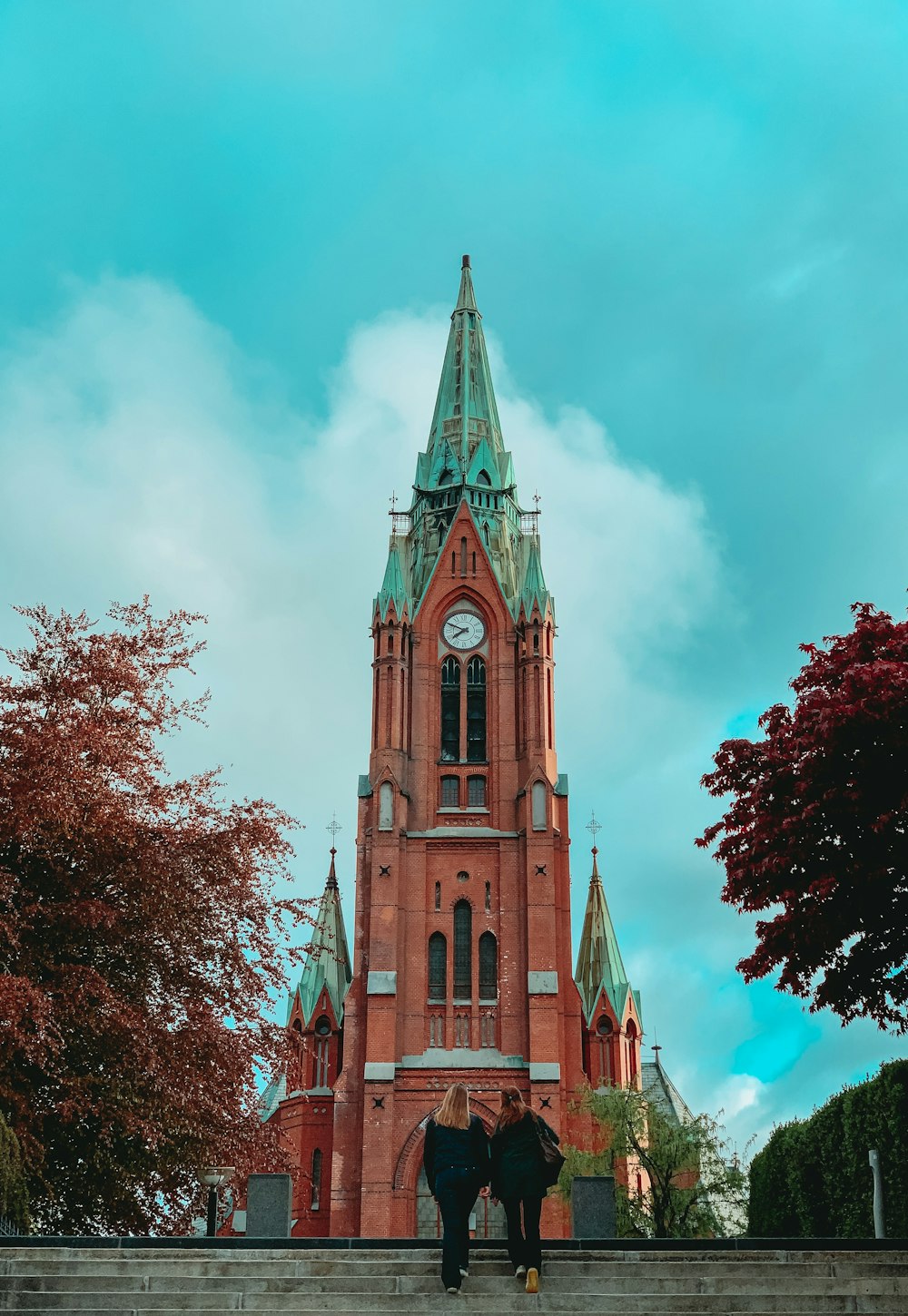 two person's facing cathedral