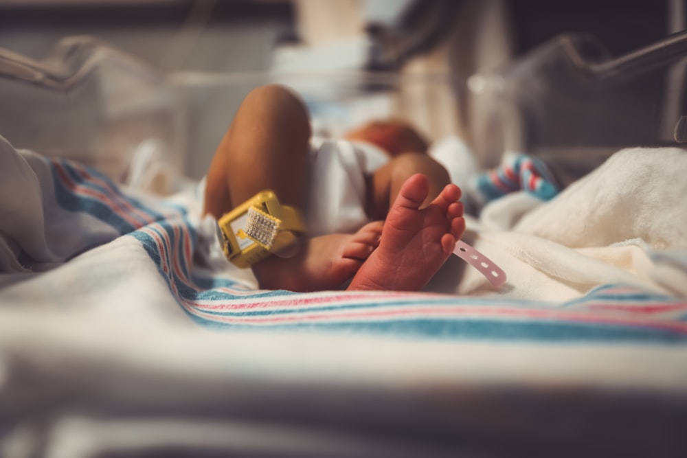 baby lying on bed