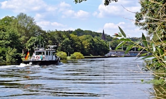 A serene view of the German Channel waters with a local elder sharing stories to a small group of tourists.